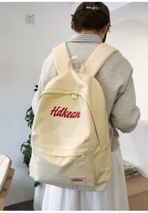 College style canvas backpack for women, lightweight minimalist daily commuter school bag.