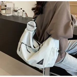 Casual canvas messenger bag for men and women, stylish commuter crossbody shoulder bag with pouch.