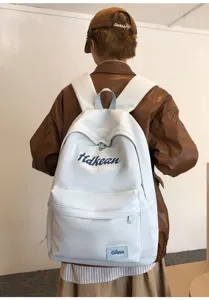 Casual college style backpack for women, lightweight commuter school bookbag with pockets.