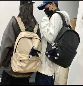 Casual nylon backpack with cute monkey pendant, large capacity school bag for women and daily.