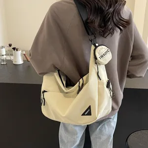Casual canvas crossbody shoulder bag for men and women, stylish messenger bag with pouch.