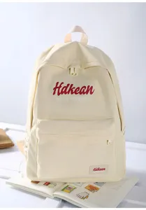 Casual minimalist canvas backpack for women students, lightweight daily commuter school bag.