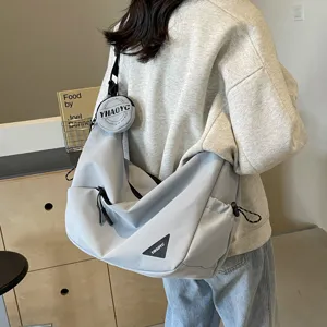 Casual messenger bag for men and women, stylish grey cross body shoulder bag for daily commuting.