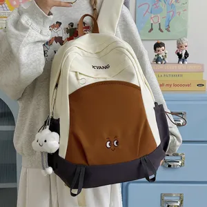Large capacity color-block casual travel school backpack for students, stylish and durable.