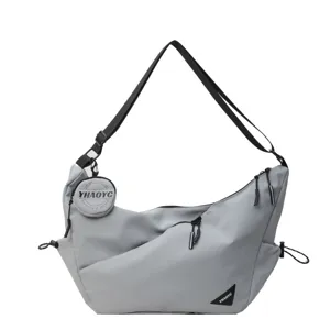 Grey tooling casual crossbody bag for men and women, stylish commuter messenger bag for cycling.