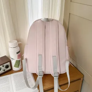 Minimalistische roze schoolrugzak met grote capaciteit voor dames en studenten.