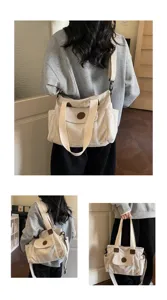 Detailed view of casual corduroy tote bag showing shoulder strap and front pocket design in daily life.