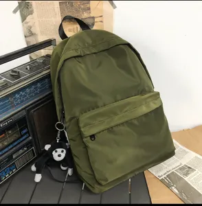 Minimalist army green canvas school backpack for daily use, college, and casual travel.