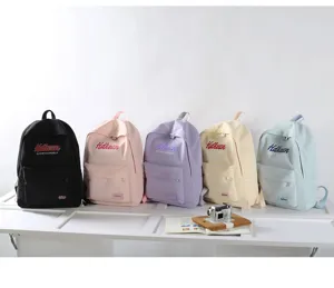 College style school backpack detail view displaying multi-color options and front pocket