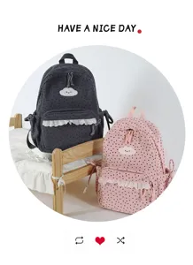 Detailed view of Japanese sweet polka dot backpack with cute cloud embroidery and lace trim.