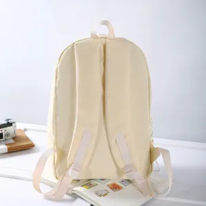 Minimalist beige campus backpack for women, lightweight casual school bag for daily commute.