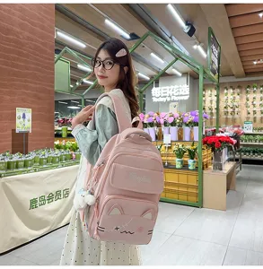 Detailed view of the cute pink cat schoolbag, showcasing embroidery and casual travel style.