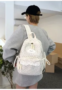Details of sweet Japanese style corduroy backpack with cute cloud embroidery and star print.