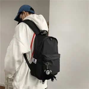 Japanese style minimalist black backpack, large capacity school bag for daily student commuting.