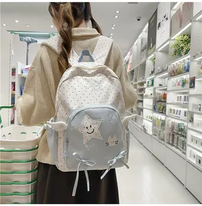 Zaino scolare in stile giapponese con pois carini, ricamo di stelle e fiocchi per uso quotidiano.
