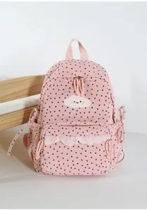 Pink corduroy backpack detail featuring cute star print, white lace trim, and cloud embroidery.