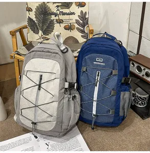 Detailed view of casual backpack with multi-pocket and elastic cord, daily outdoor travel bag.