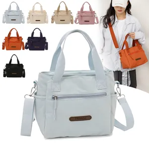 Nylon casual shoulder bag detail showcasing multiple pockets, durable zipper, and versatile strap.