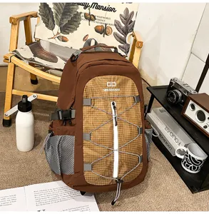Large capacity brown casual backpack with mesh side pockets and front zip pocket for travel.