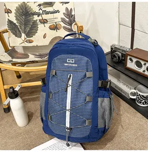 Close-up detail of large capacity casual backpack with elastic bungee cords and mesh side pockets.