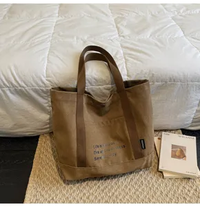Casual canvas tote bag for women, large capacity shoulder bag for daily commute and school.