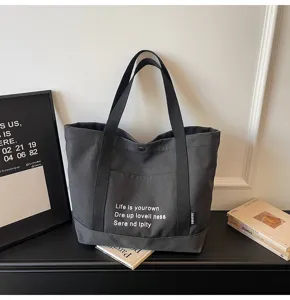 Casual canvas tote bag for women, large capacity shoulder handbag for daily commute and school.