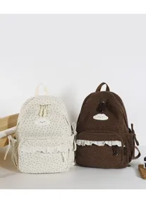 Detailed view of sweet Japanese style school backpacks with star patterns, cute cloud patches.