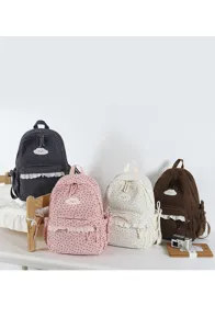 Cute Japanese style polka dot corduroy backpack detail with lace trim and sweet cloud embroidery.
