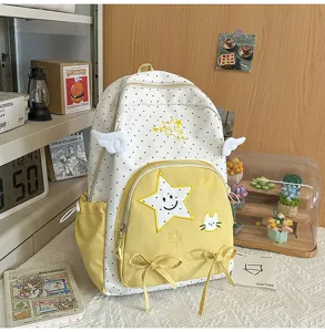 Zaino carino a pois con tasca frontale gialla, ricamo stella kawaii e dettagli con ali.