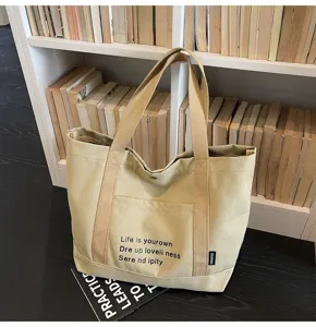 Canvas tote bag for women, large capacity casual shoulder bag, stylish commuter handbag.