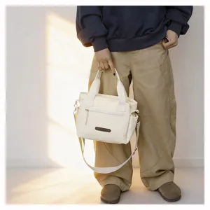 Casual minimalist canvas crossbody tote bag for women daily commute travel lightweight handbag.