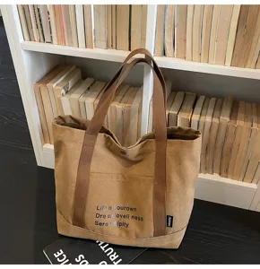 Korean canvas commuter tote bag for women, large capacity casual shoulder bag for daily use.