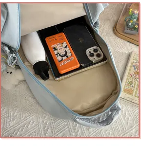 Detail view of the cute casual schoolbag interior capacity, showing spacious storage space.