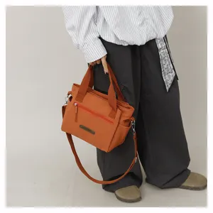 Detail view of a casual nylon shoulder crossbody bag for women, spacious and lightweight.