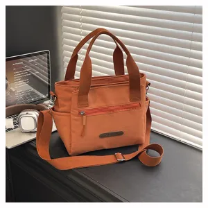 Minimalist orange nylon shoulder bag, large capacity casual crossbody handbag for women.