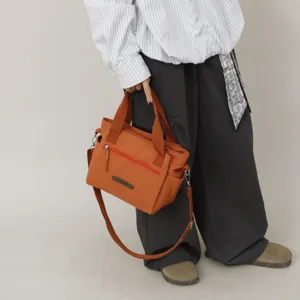 Casual nylon shoulder messenger bag for women, large capacity daily commuter handbag.