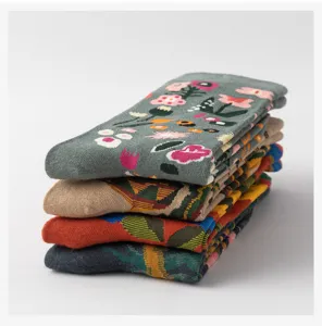 Detailed view of colorful retro floral patterned cotton socks stacked together neatly.