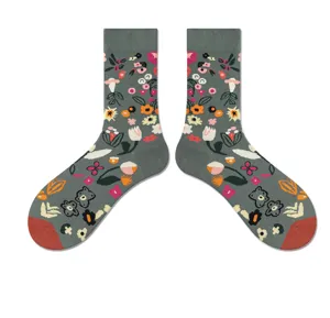 Detailed view of vintage floral mid-calf cotton socks in grey with colorful botanical prints.