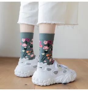 Retro floral print socks close up, gray green cotton mid tube socks street style detail.