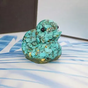 Detailed view of the cute crystal gravel epoxy duck figurine, highlighting texture and craft.
