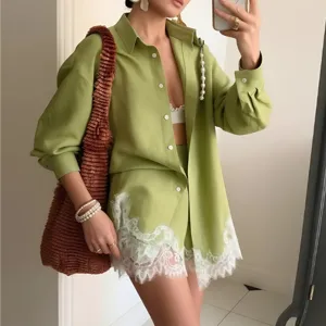 Casual green long sleeve shirt and lace trim shorts set with woven tote bag for summer holiday.