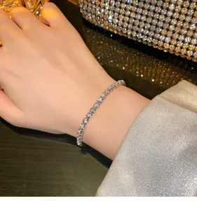 Elegant sterling silver finish zircon tennis bracelet, sparkling crystal wrist jewelry for women.