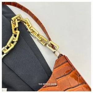 Brown crocodile pattern baguette shoulder bag with stylish chunky gold chain detail.