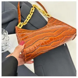 Brown crocodile pattern baguette bag with chunky gold chain, stylish underarm shoulder handbag for women.
