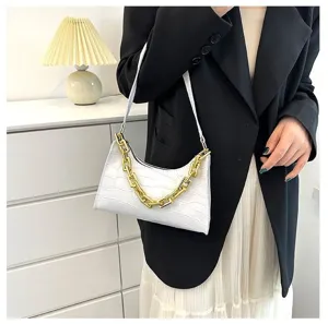 Detailed view of a trendy white crocodile pattern baguette shoulder bag with a gold chain.