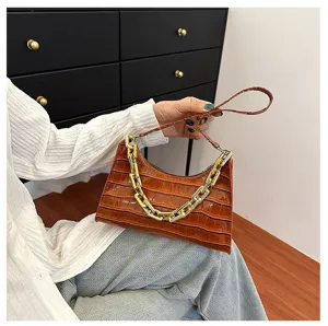 Brown crocodile pattern baguette bag with chunky gold chain strap for women stylish.