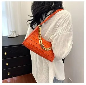 Orange crocodile pattern baguette shoulder bag detail, stylish women chain handbag showcase.