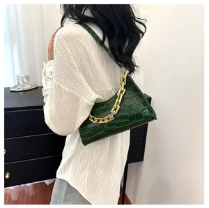 Green crocodile texture baguette shoulder bag with chunky gold chain strap for women.