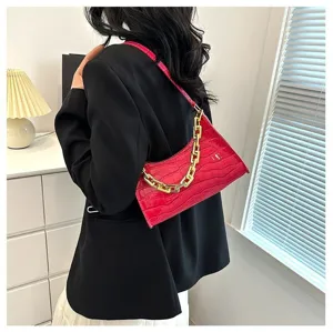 Stylish crocodile pattern baguette shoulder bag with chic gold chain for trendy women.