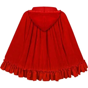 Detailed view of the red velvet hooded cape, showing soft fabric and delicate ruffle hem.